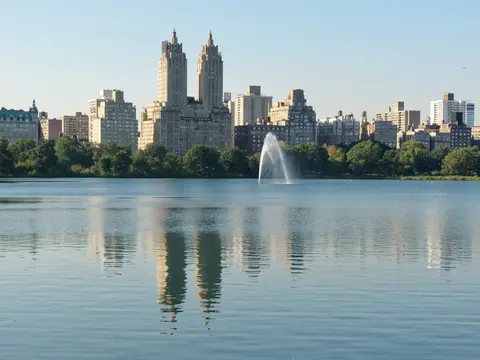 The Central Park Reservoir and its fountain with the Upper West Side skyline